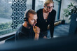 © Jacob Lund - Businessman with headset working at his desk with manager