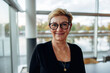© Jacob Lund - Senior business woman standing in office