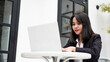 © HumbaFrame - Asian young business woman working on computer in office