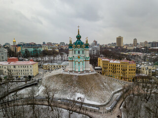 Wall Mural - St. Andrew's Church in Kiev in snowy weather. Aerial drone view.