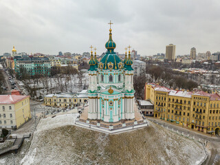 Wall Mural - St. Andrew's Church in Kiev in snowy weather. Aerial drone view.