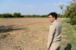 © ULTRAPOK - A Thai government official works outside the office, to explore the farming areas of the villagers.