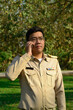 © ULTRAPOK - A Thai government officer, Civil servant is making a phone call.