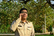 © ULTRAPOK - A Thai government officer, Civil servant is making a phone call.