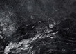 Textured marble, ice surface. Cool, dark, distressed grunge background.