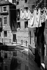 Wall Mural - Canal in Venice with old houses and airing linen