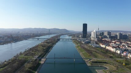 Wall Mural - Vienna Danube and City aerial panoramic view. Donaustadt Kagran district at the Danube. Modern city quarter with skyscrapers and business office centres.