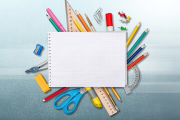 Poster - Colorful school supplies on wooden table background