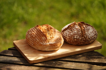 Freshly baked organic sourdough bread. White and whole grain with pumpkin seeds