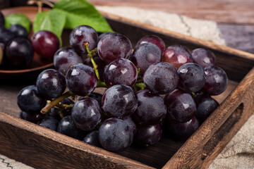 Wall Mural - Close up of a bunch of purple grapes