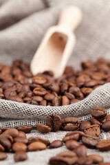 Wall Mural - brown coffee beans lying on a table made of boards