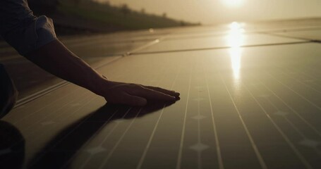 Wall Mural - cinematic shot of maintenance assistance technical worker in uniform is cleaning photovoltaic solar 