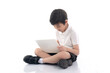 © lalalululala - Cute Asian child sitting and using laptop on white background isolated