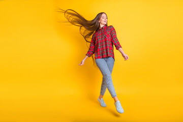 Sticker - Full size photo of young good mood girl enjoying weekend walking dancing isolated on yellow color background