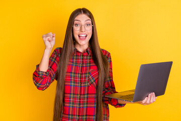 Poster - Portrait of nice hooray brunette long hairdo lady hold laptop wear spectacles red shirt isolated on vivid yellow color background