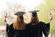 © mnirat - Female graduates of a university graduate holding a degree certification to shows and celebrate education. success on the college.