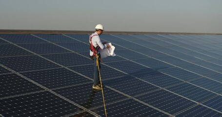 Wall Mural - cinematic shot of assistance technical worker in uniform checking operation and efficiency of photov