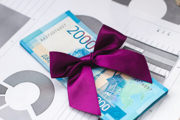 Canvas Print - paper money with a purple bow on top. russian rubles