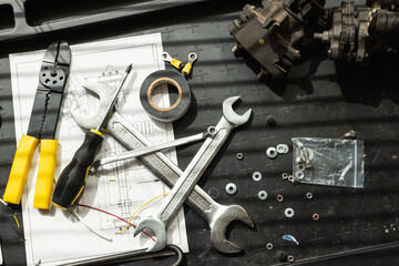 Messy set of tools on a working table in a garage