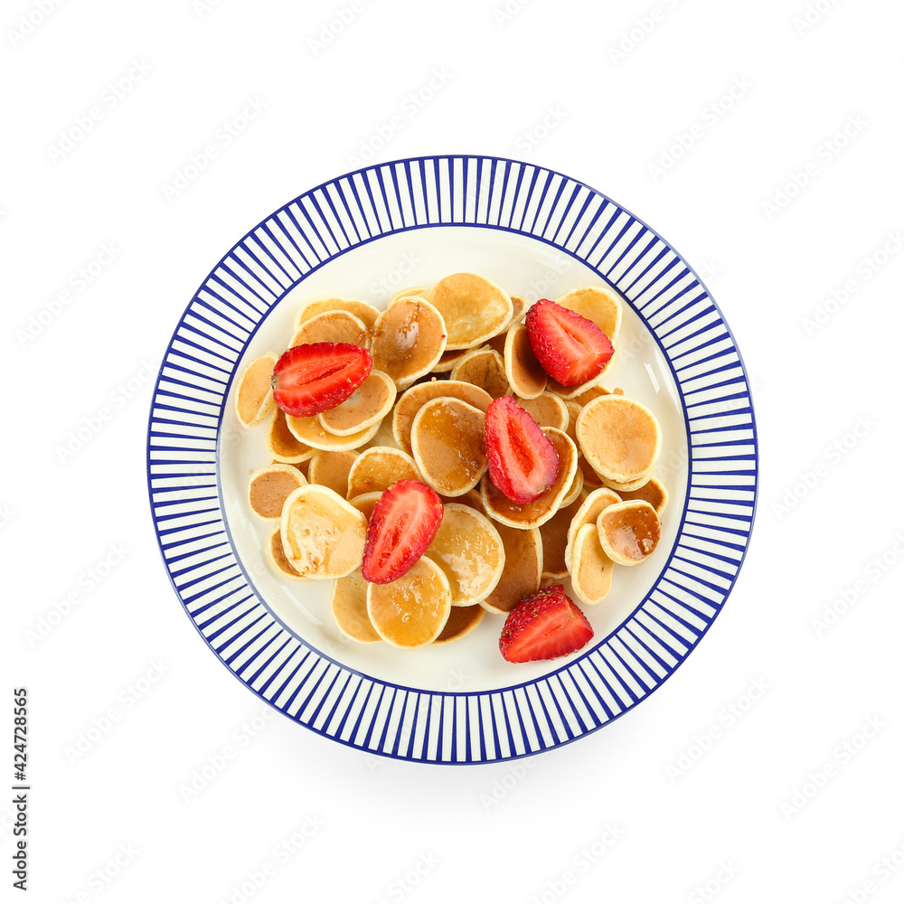 Plate with tasty mini pancakes and strawberry on white background