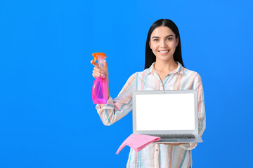 Sticker - Young woman cleaning laptop on color background