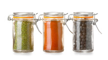 Jars With Different Spices On White Background