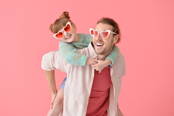 Poster - Portrait of happy father and daughter on color background