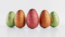 Easter Eggs Isolated Against A White Background. Chocolate Eggs Wrapped In Patterned Green, Orange And Red Foil. 3D Render