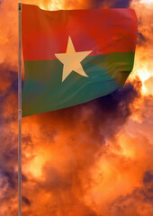 Burkina Faso flag on pole with sky background