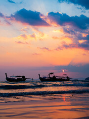 Wall Mural - Traditional thai boats at sunset beach. Ao Nang Krabi province