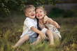 Funny twins boy and girl in country