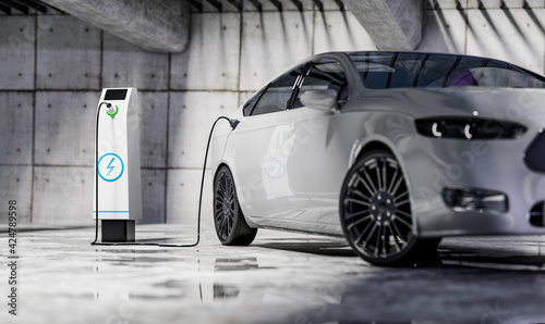Obraz Dibond Charging an electric car with a public charger in a parking lot