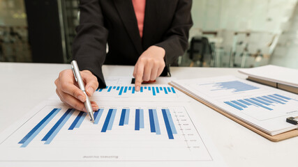 Business woman analysis of financial company investment data graph