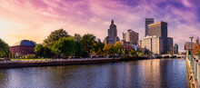 Providence, Rhode Island, United States. Panoramic View Of A Modern Downtown City Skyline On The Atlantic Ocean East Coast. Colorful Sunset Sky Art Render.