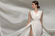 © Alena - Fashion woman portrait in white long flying airy dress