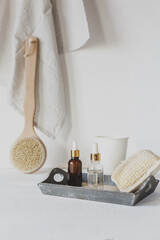 Wall Mural - Zero waste, sustainable bathroom and lifestyle. Bamboo massage brush, loofah sponge, natural oil, DIY products in glass bottles on white background.Eco cosmetics