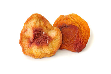 Two slices dried peaches isolated on white