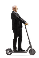 Poster - Mature businessman riding an electric scooter