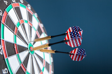 dart arrow hitting in the target center of dartboard.