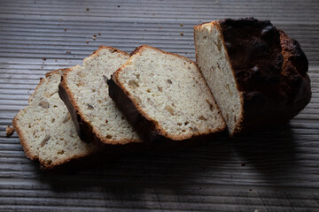 Fresh baked loaf of banana bread on a wood table