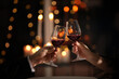 canvas print picture - Couple clinking glasses at Valentine's day dinner in restaurant, closeup