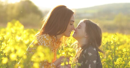 a friendly and loving family in nature. emotional portrait of a happy and cheerful beautiful young m