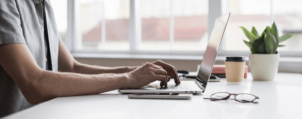 man typing on computer keyboard panoramic banner, businessman, designer or student using laptop at h