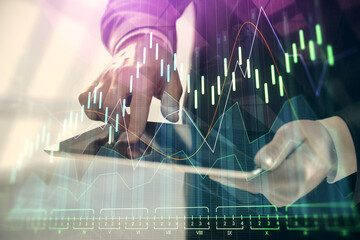 Aufkleber - Double exposure of man's hands holding and using a digital device and forex graph drawing. Financial market concept.