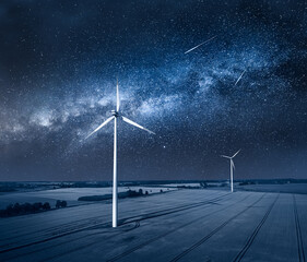 Wall Mural - milky way over field with wind turbines. alternative energy, poland.
