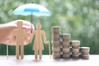 © Monthira - Mutual fund,Love couple senior and stack of coins money on natural green background, Save money for prepare in future and pension retirement concept