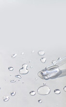 Pipette With Serum Or Fluid Hyaluronic Acid On Gray Background