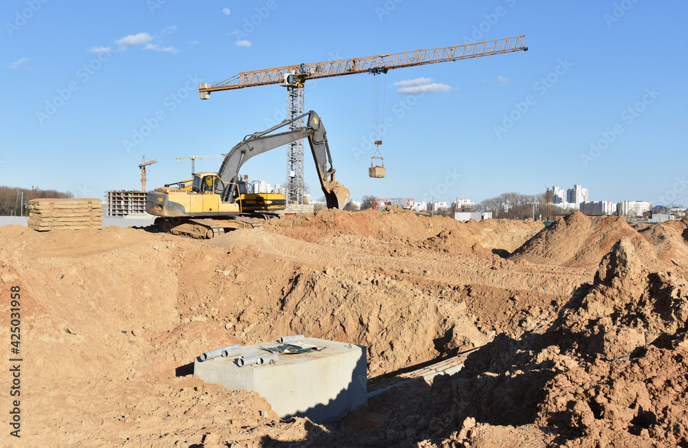 Excavator dig the trenches at a construction site. Trench for laying ...