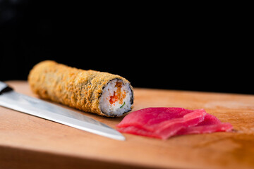 sushi with salmon and knife