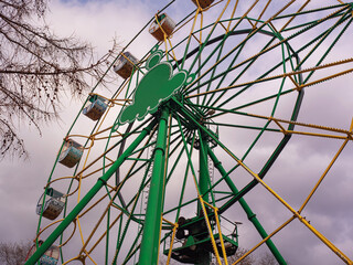 A Ferris wheel (or a Big Wheel) in urban public park.